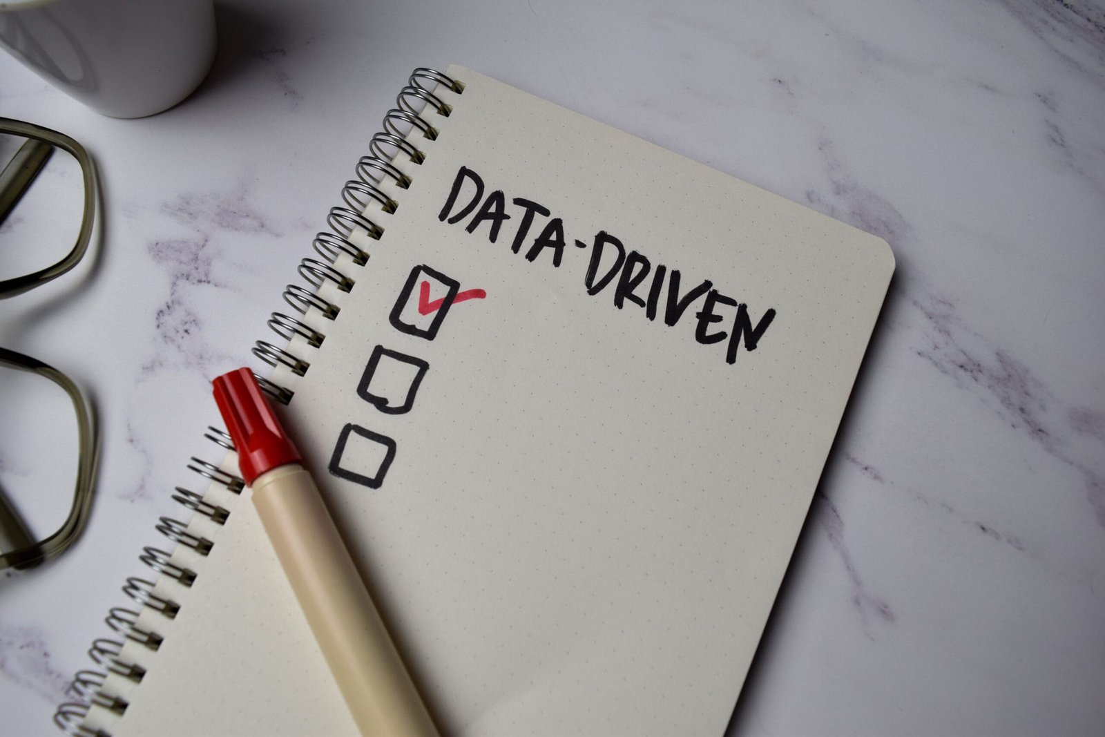 Data Driven write on a book isolated on Office Desk