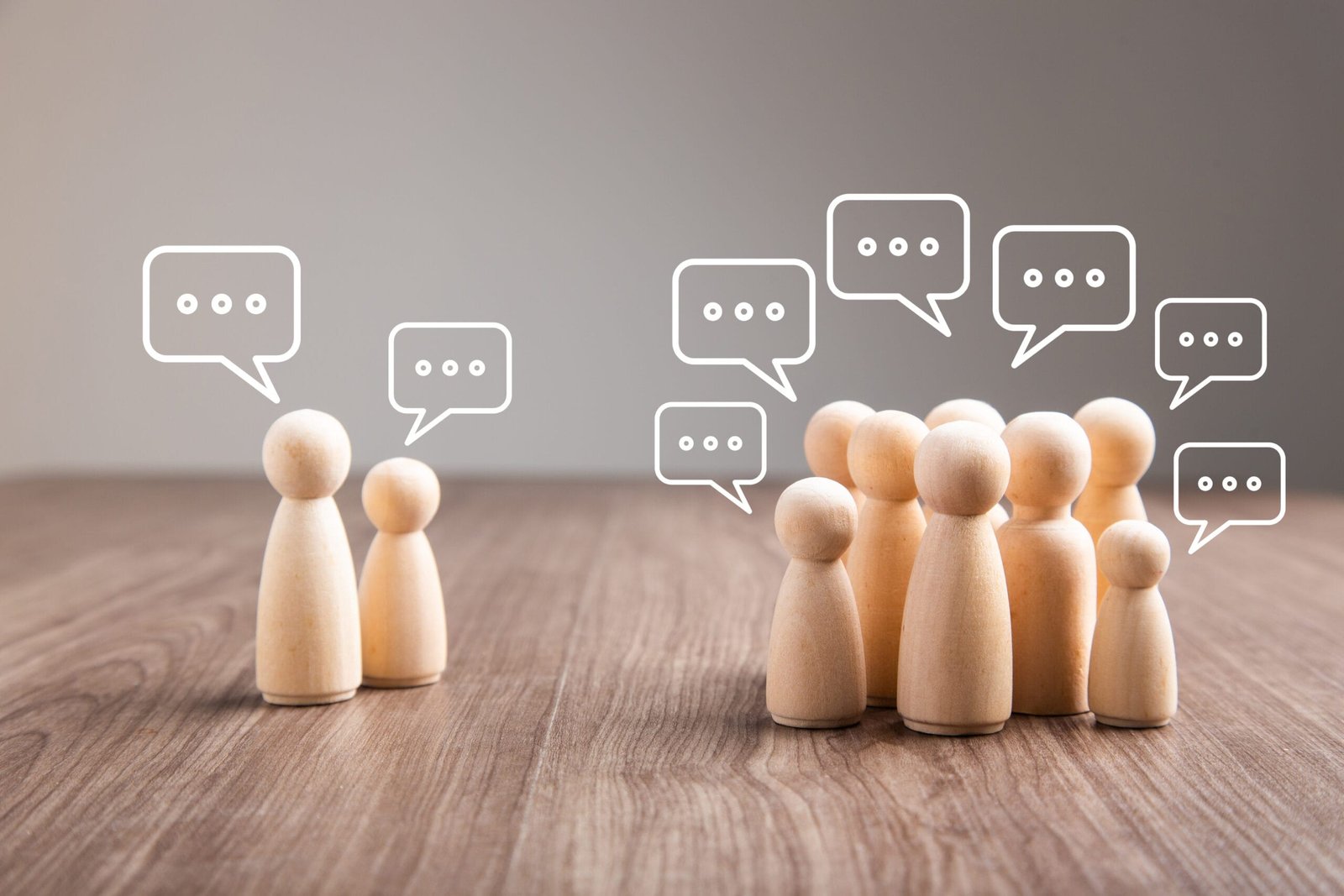 Wooden figurine with speech bubble. Mingle, discussion, chatting